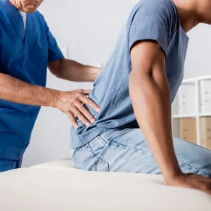 Neurosurgery patient being examined by a provider
