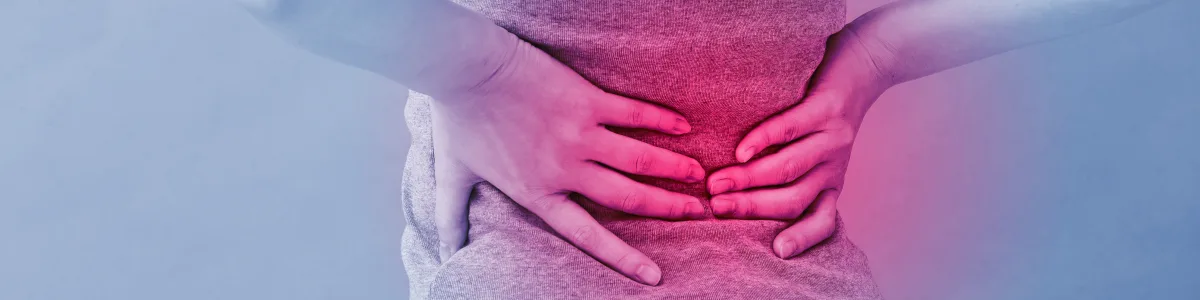 Person holding their lower back in pain